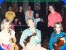 Bill Youdelman, Jenny, Roscoe Beck, Leonard (back) - Suzie Katayama, Larry Corbett, Bill Ginn (center) - Barbara Porter, Sid Page, Novi Novog (front) - Photo copyright © Roscoe Beck